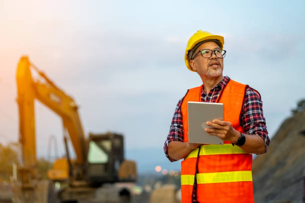 Engineer inspects onsite for heavy equipment repair
